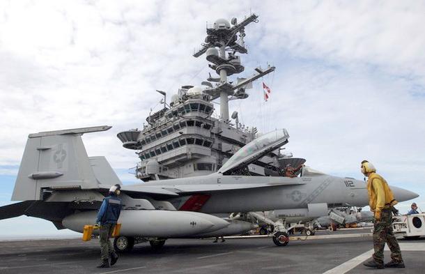 Pilots conduct test flights from the deck of the USS George Washington aircraft carrier off the coast of the Korean Peninsula