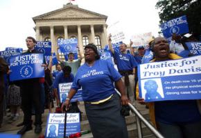 Demonstrators gather to support Troy Davis on September 11 in Atlanta in front of the state capitol