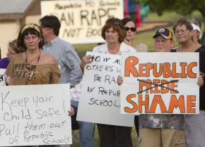 Parents and community members protest the failure of the Republic School District to keep a young rape victim safe