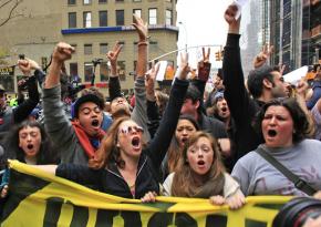 Occupy protesters march toward Liberty Plaza after police evicted them in the early morning hours
