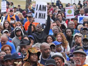 Thousands join in a rally outside the Alabama State Capitol building in defense of voters, workers and immigrant rights