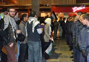 Palestine solidarity activists face off against police at a demonstration in Melbourne