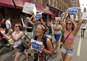 Protesters at SlutWalk Detroit carry signs protesting state lawmakers' censure of the word "vagina"