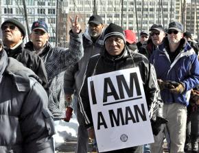 School bus drivers and supporters march across the Brooklyn Bridge during their strike