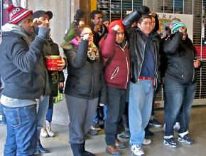 Snarf's workers and their supporters protest after learning the shop was closed